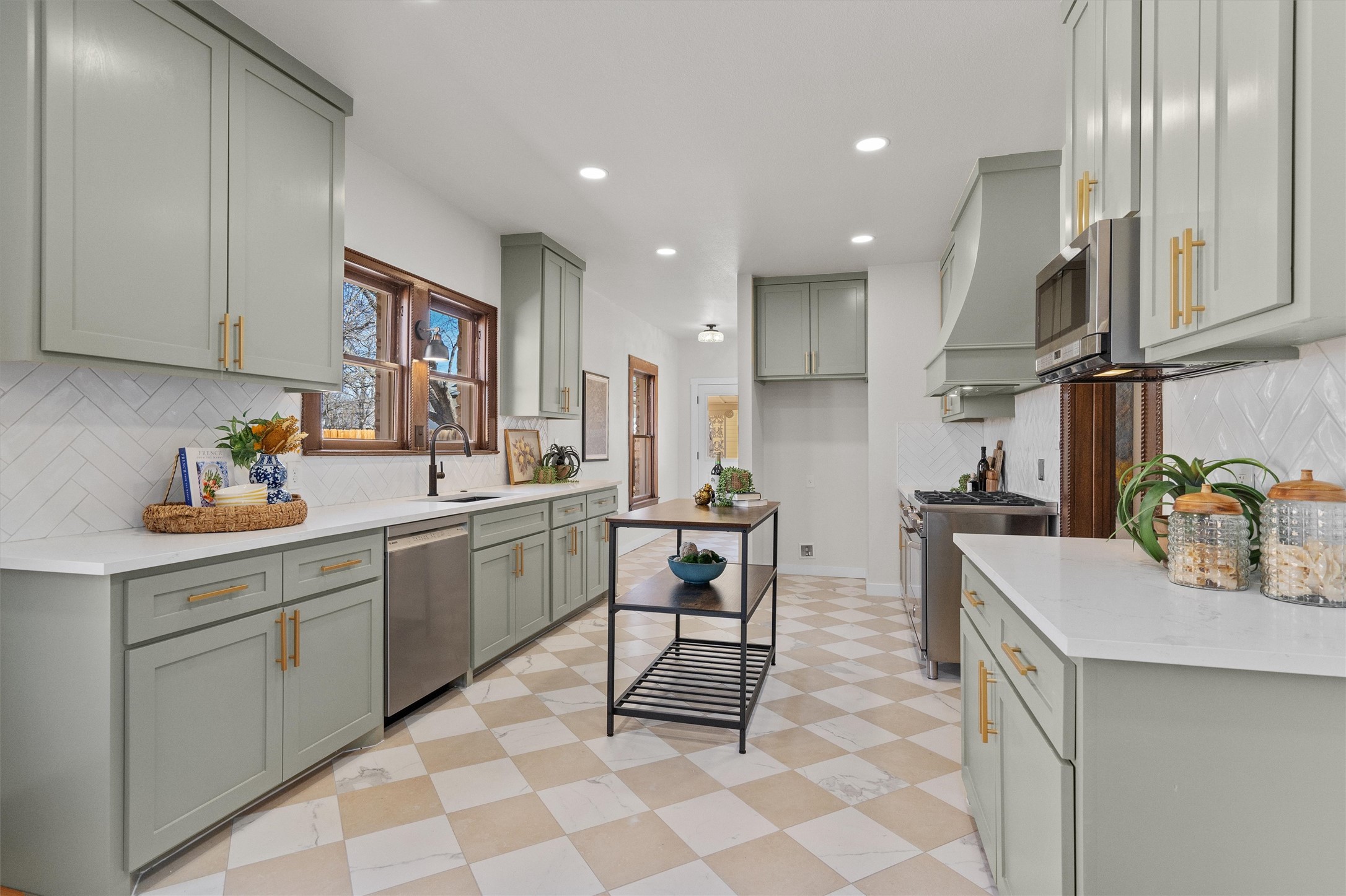 1605 South Austin Avenue Georgetown, TX 78626 - Photo 10 of 40 Kitchen featuring light flooring, tasteful backsplash, light stone counters, and recessed lighting