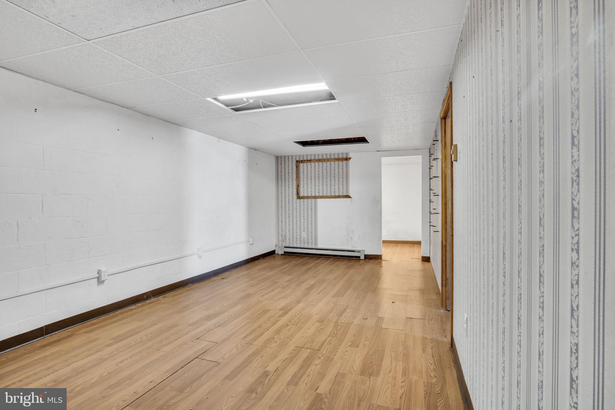 1575 Church Road York, PA 17408 - Photo 18 of 32 a view of a room with wooden floor and white walls