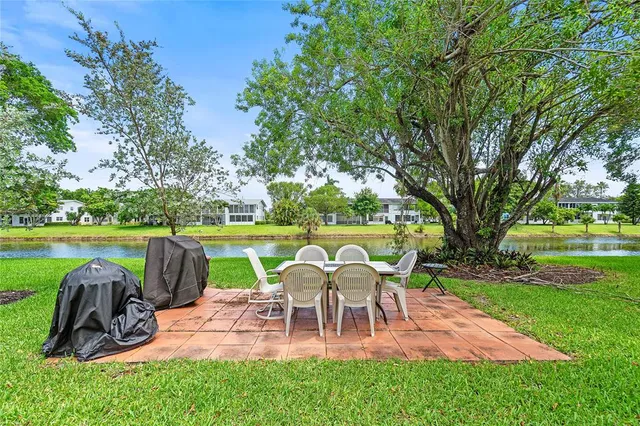 a view of a table and chairs in the garden