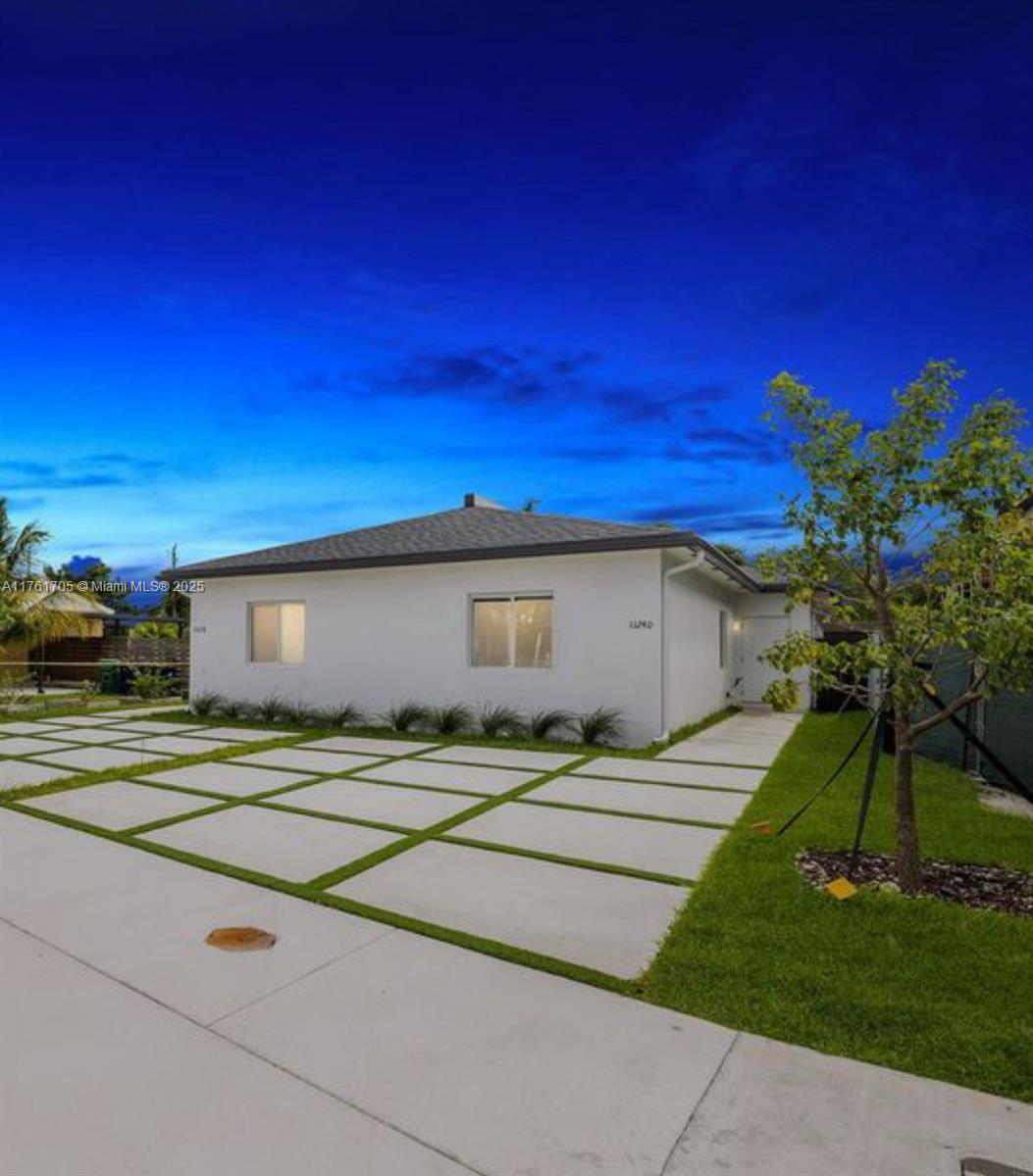 11240 Southwest 187th Street, Unit 11240 Miami, FL 33157 - Photo 8 of 9 a house view with a outdoor space