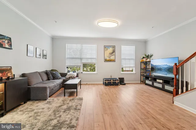 a kitchen with granite countertop kitchen island stainless steel appliances a sink stove and refrigerator