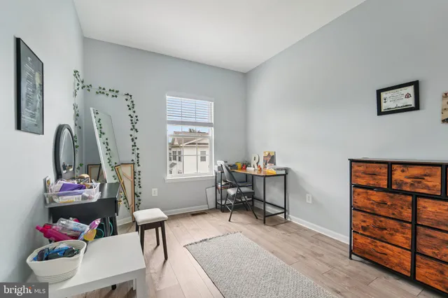 a front view of a residential apartment building with a yard