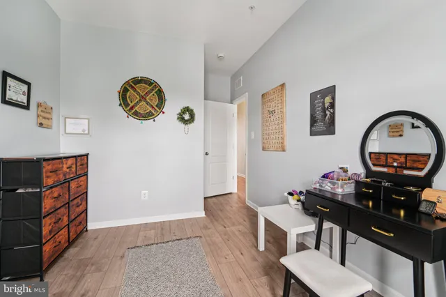 a aerial view of a brick building next to a yard