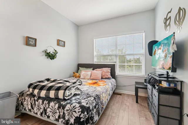 a view of a kitchen with a sink and cabinets