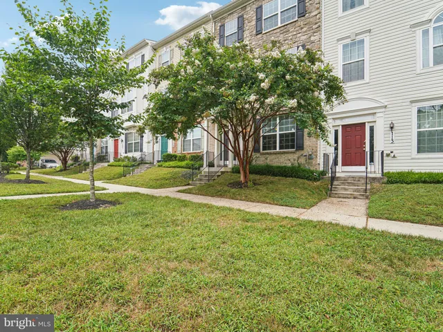 a view of hallway with wooden floor and stairs