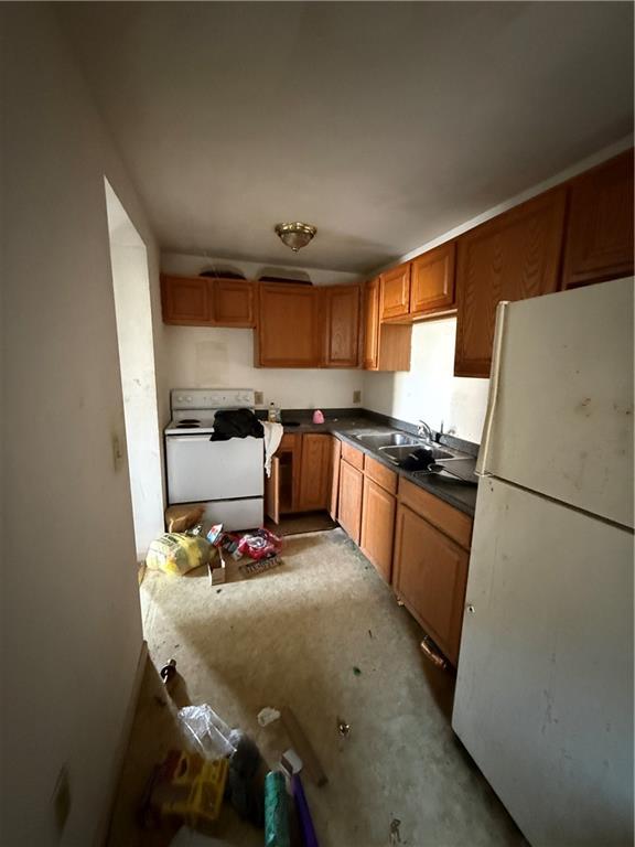 324 West New Castle Street Butler, PA 16001 - Photo 8 of 16 a kitchen with a refrigerator and a stove