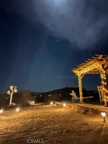 a backyard of a house with wooden floor
