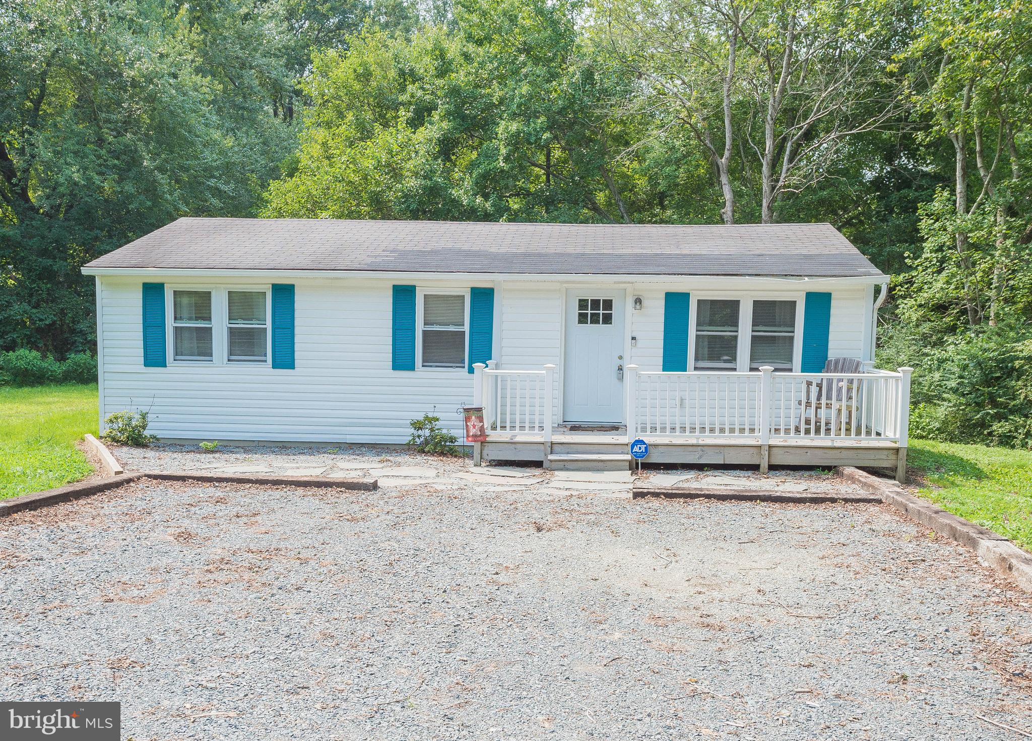 9201 Seahawk Road Berlin, MD 21811 - Photo 1 of 42 Front of home with gravel driveway