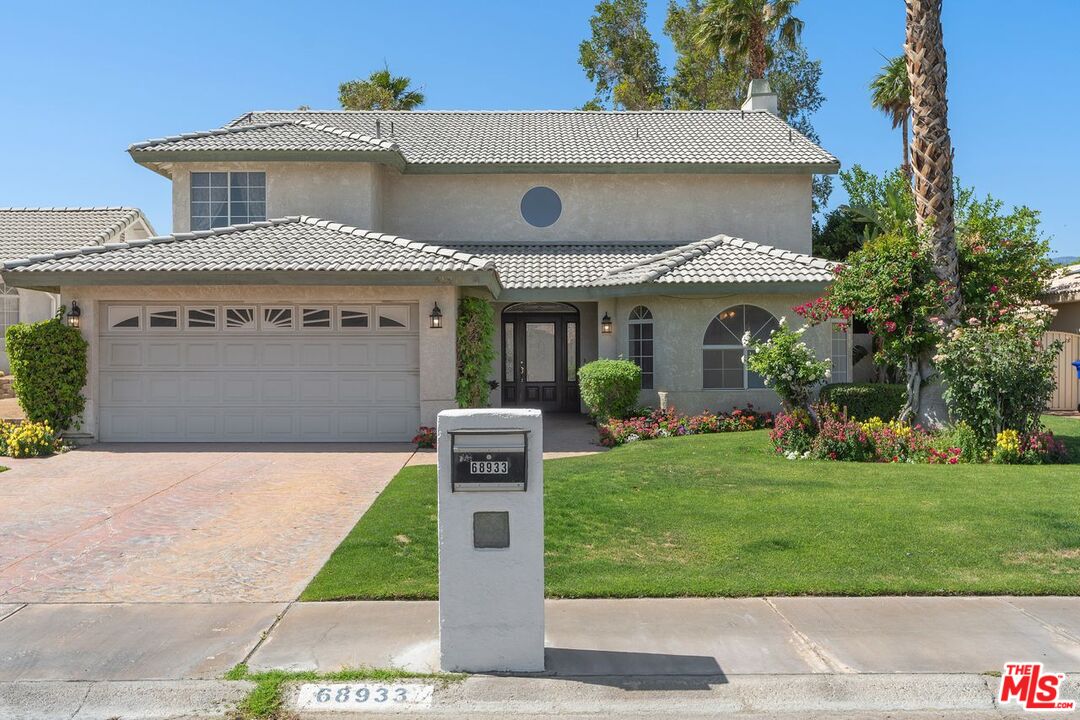 a front view of house with yard