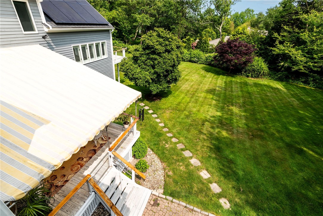 48 Wright Lane Jamestown, RI 02835 - Photo 16 of 48 View of grounds from the balcony of the sitting room off primary bedroom. Offers winter water views of Narragansett Bay.