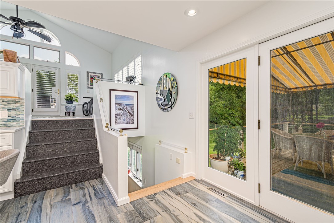 48 Wright Lane Jamestown, RI 02835 - Photo 26 of 48 The kitchen leads to an upper family room, or down to a craft room.
