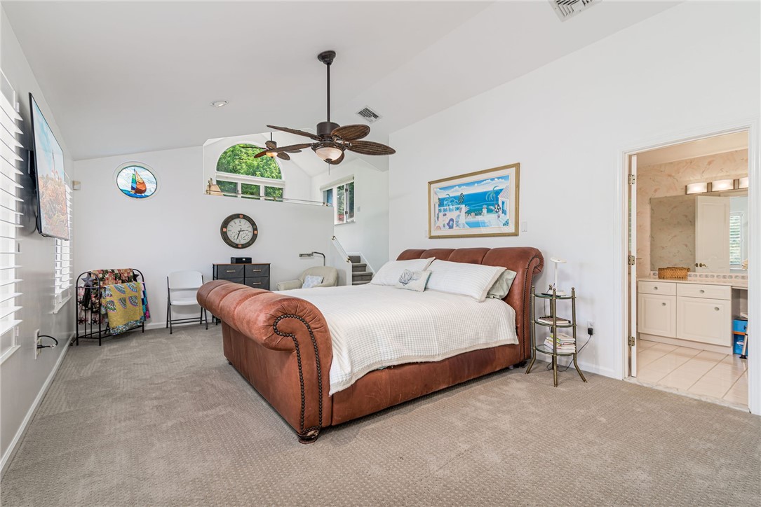 48 Wright Lane Jamestown, RI 02835 - Photo 31 of 48 Vaulted primary bedroom with elevated sitting area, and spacious ensuite bath