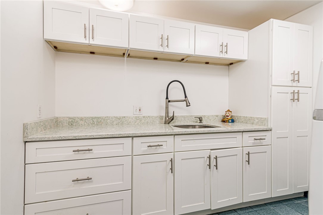 48 Wright Lane Jamestown, RI 02835 - Photo 36 of 48 Spacious laundry room with abundance of cabinets and soaking sink