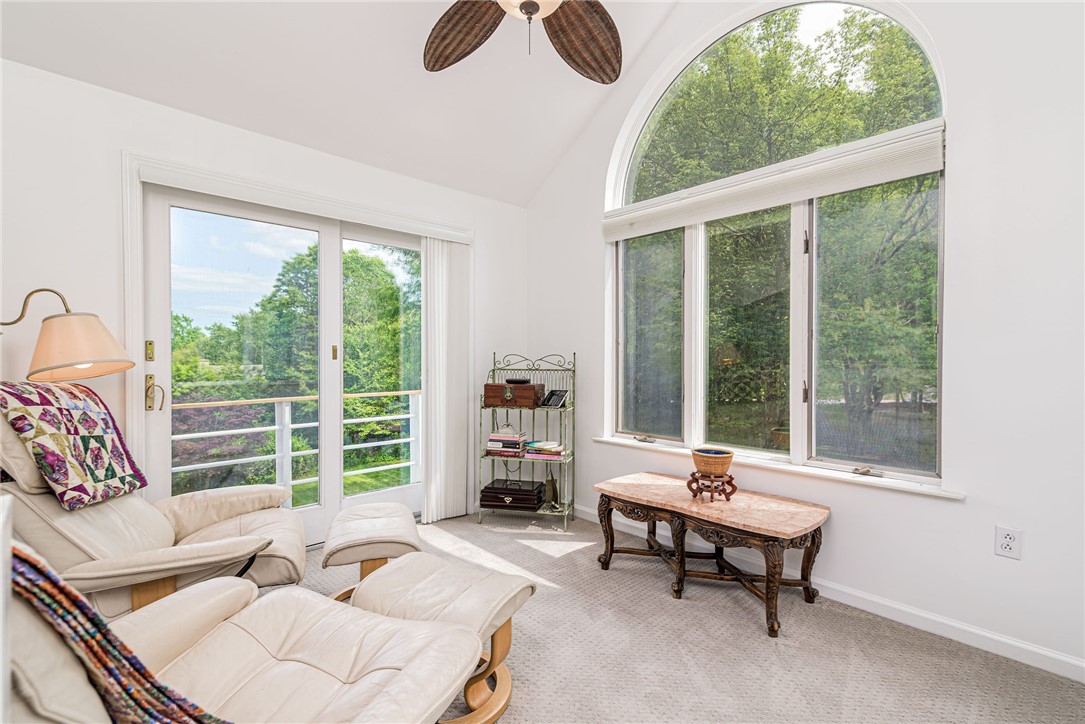48 Wright Lane Jamestown, RI 02835 - Photo 43 of 48 Elevated vaulted sitting room adjacent to primary bedroom with balcony overlooking the yard below