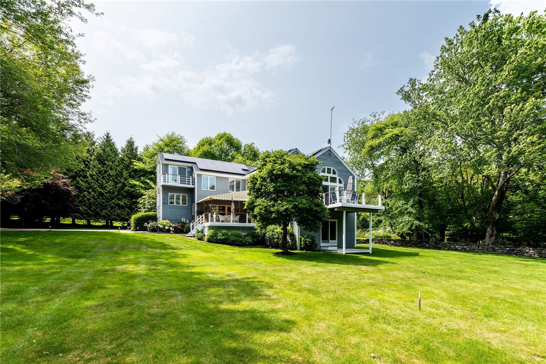 48 Wright Lane Jamestown, RI 02835 - Photo 5 of 48 East elevation of the home showing multiple decks and balcony