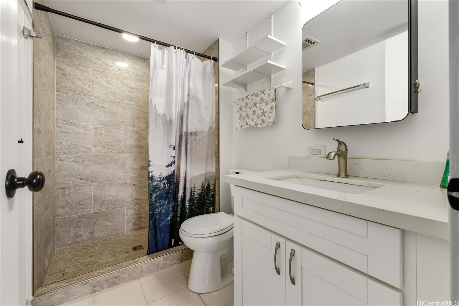 3161 Ala Ilima Street, Unit 1616 Honolulu, HI 96818 - Photo 11 of 23 a bathroom with a shower sink vanity mirror and toilet