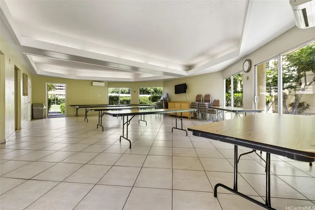 a swimming pool with outdoor seating and yard