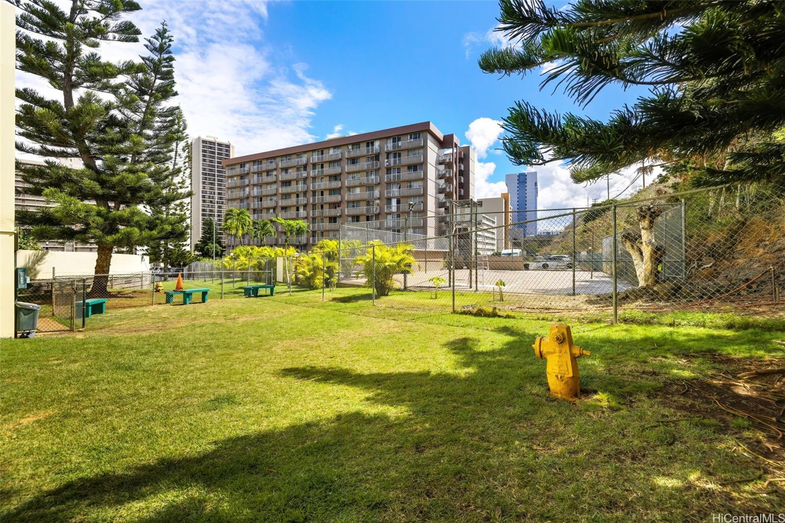 3161 Ala Ilima Street, Unit 1616 Honolulu, HI 96818 - Photo 19 of 23 a swimming pool with outdoor seating and yard