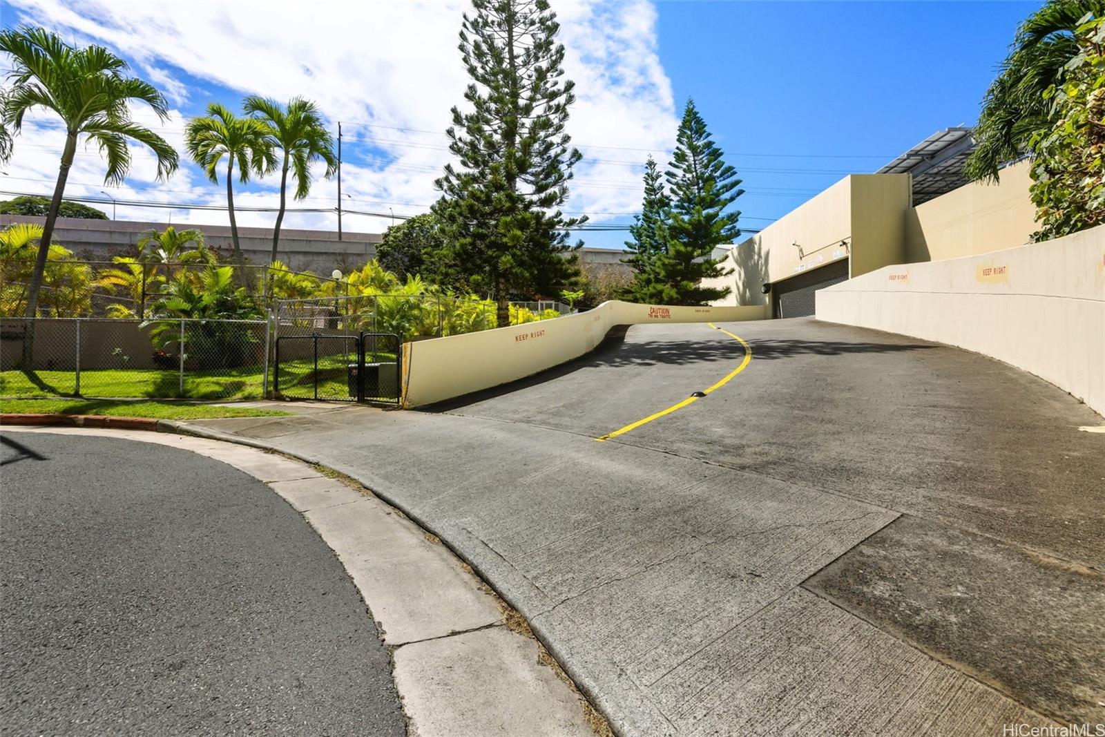 3161 Ala Ilima Street, Unit 1616 Honolulu, HI 96818 - Photo 22 of 23 a view of a park with a bench and trees