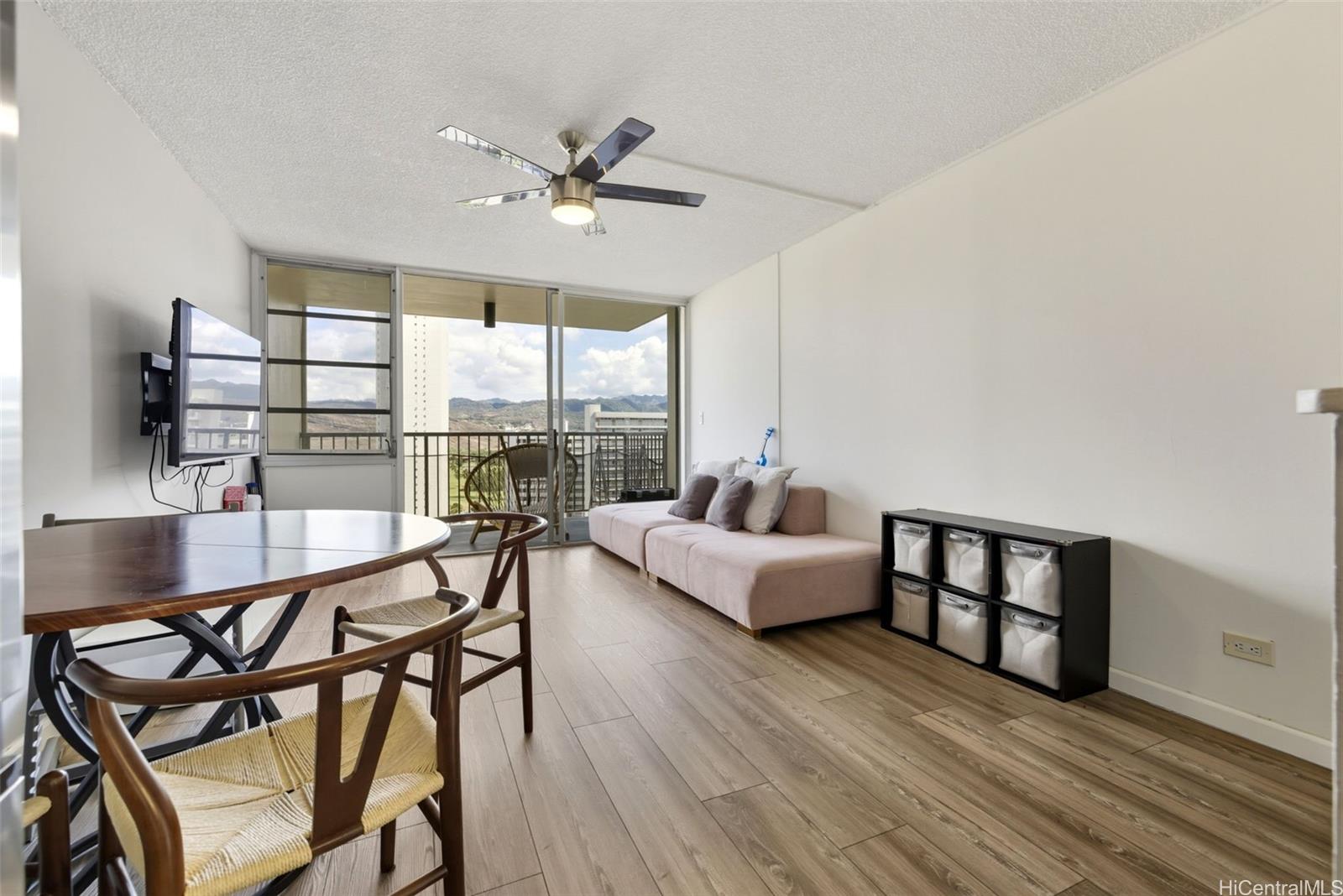 3161 Ala Ilima Street, Unit 1616 Honolulu, HI 96818 - Photo 4 of 23 a living room with furniture and a large window