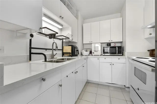 a kitchen with cabinets and appliances
