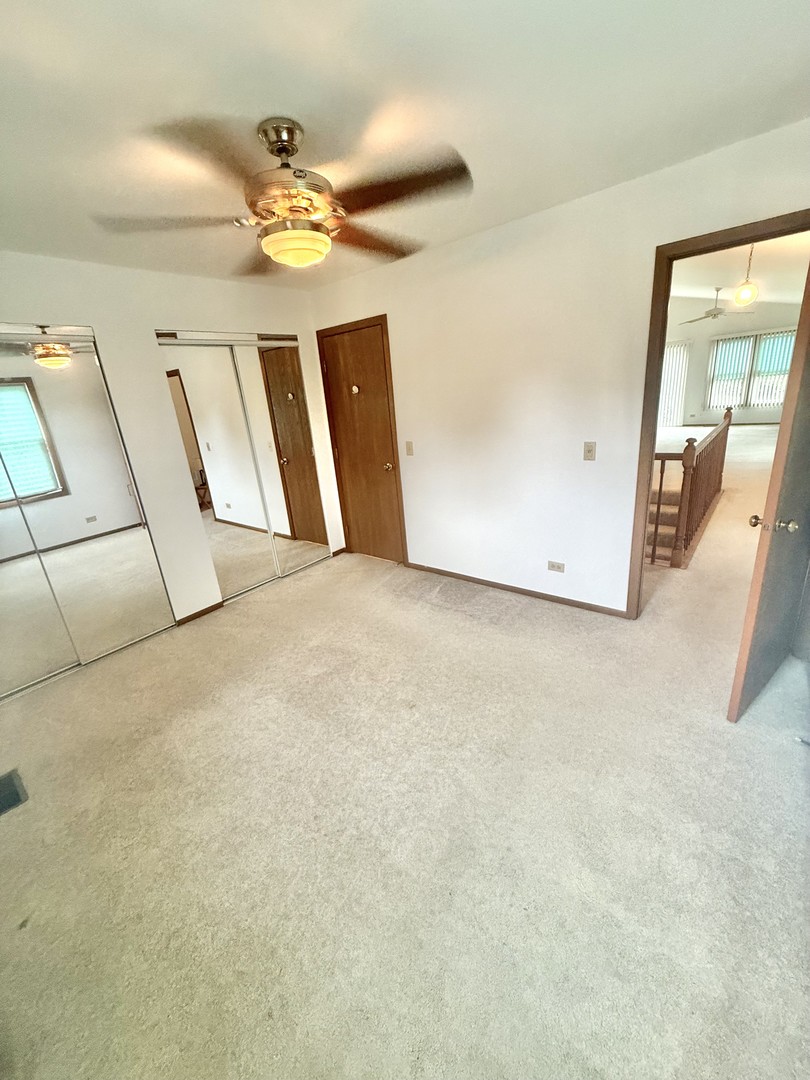 266 Greensboro Court, Unit A Elk Grove Village, IL 60007 - Photo 7 of 10 a view of a livingroom with wooden floor
