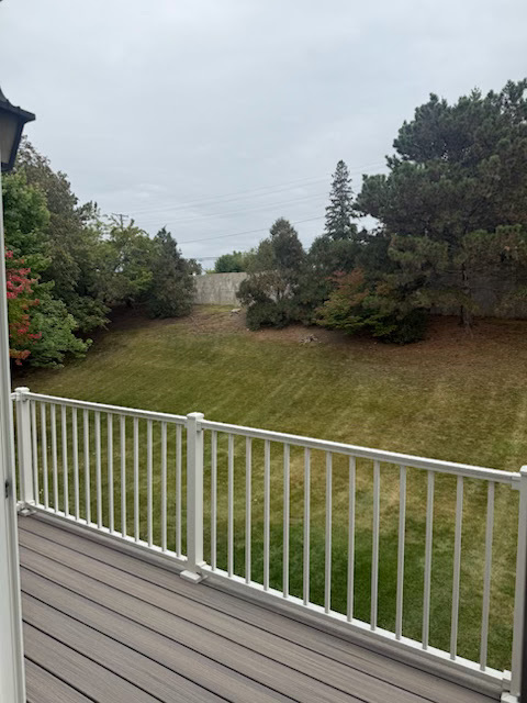 266 Greensboro Court, Unit A Elk Grove Village, IL 60007 - Photo 9 of 10 a view of a balcony with wooden floor and fence