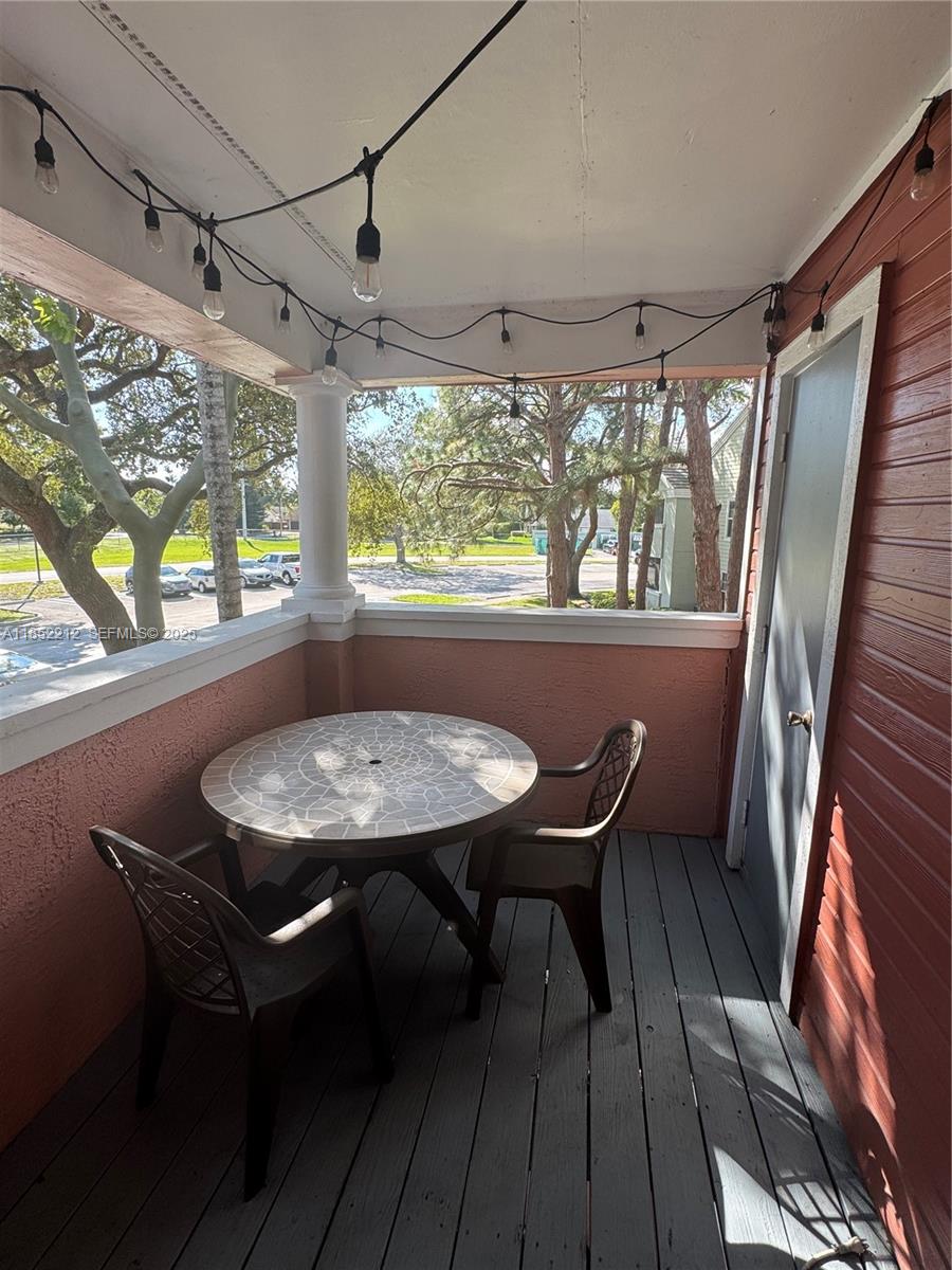 1165 Crystal Way, Unit B Delray Beach, FL 33444 - Photo 13 of 16 a view of a dining room with furniture window and outside view