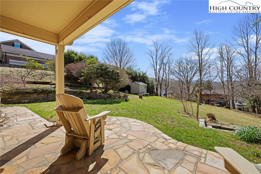 304 Glendale Drive Boone, NC 28607 - Photo 11 of 50 a view of a chair and table in backyard of the house
