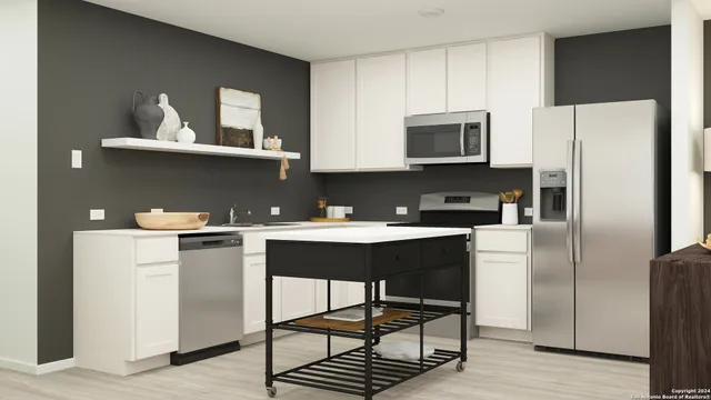 a kitchen with stainless steel appliances a refrigerator and a stove top oven