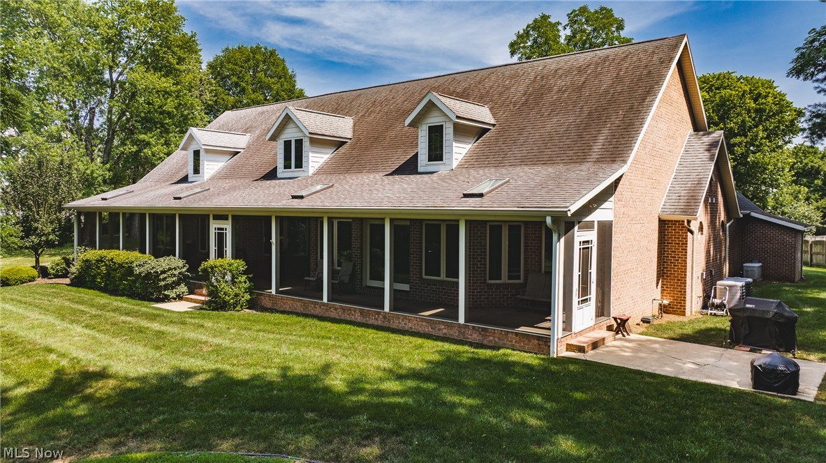 3908 River Road Vienna, WV 26105 - Photo 5 of 48 10x70 screened porch overlooking River Rd and the Golf Course. Side patio equipped with a natural gas grill for easy BBQ's!