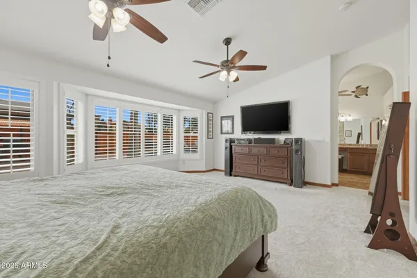 a view of walk in closet with clothes