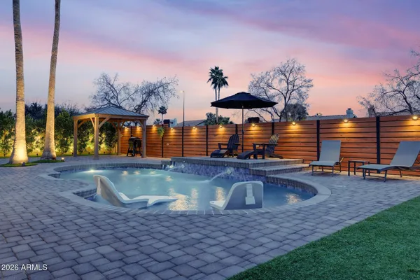 a view of a swimming pool with a patio