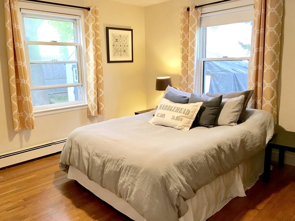 6 Susan Road Marblehead, MA 01945 - Photo 8 of 26 a bedroom with a bed and wooden floor