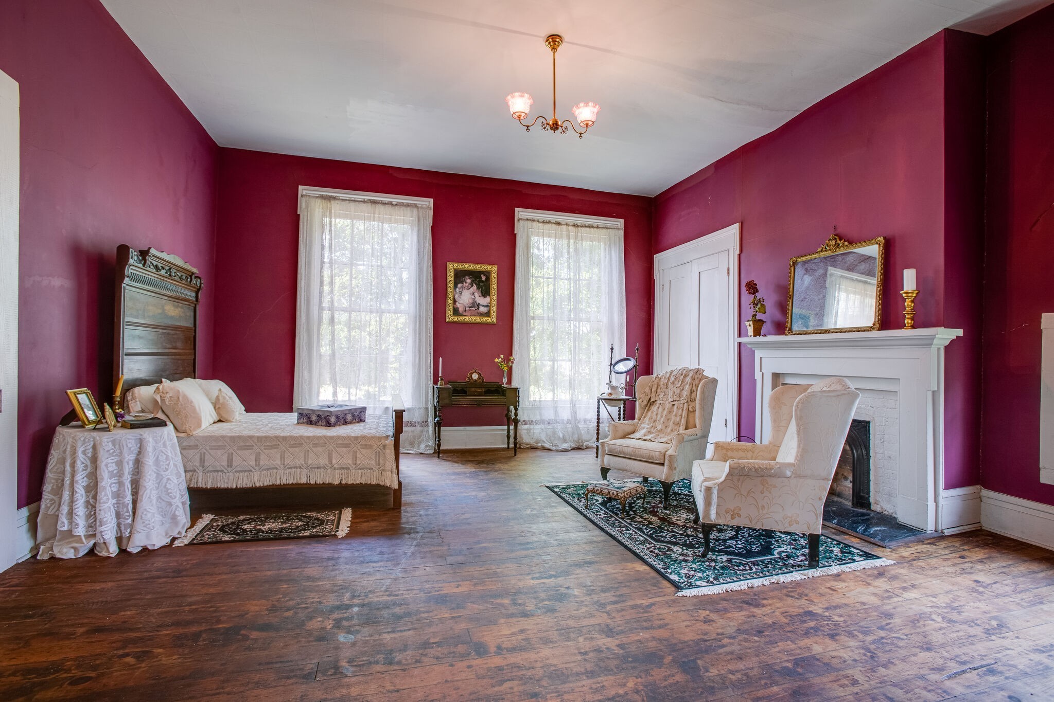 2536 Duplex Road Spring Hill, TN 37174 - Photo 17 of 32 a living room with furniture a fireplace and a chandelier