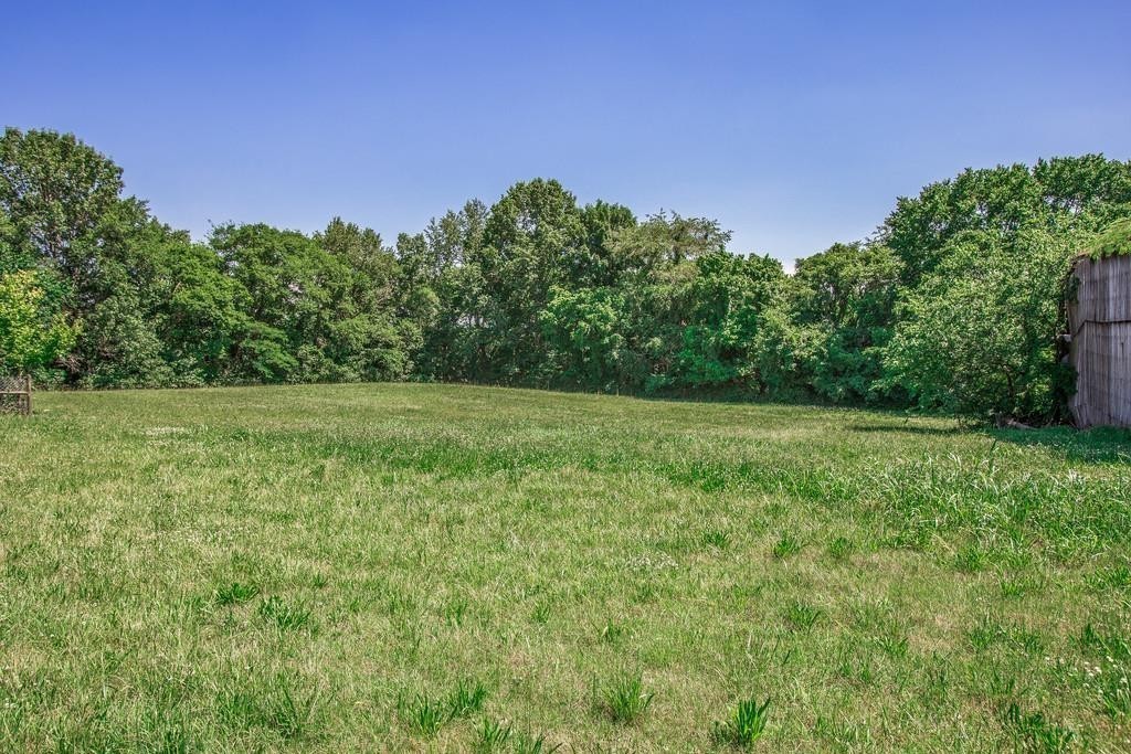 2536 Duplex Road Spring Hill, TN 37174 - Photo 27 of 32 a view of a grassy field with trees in the background