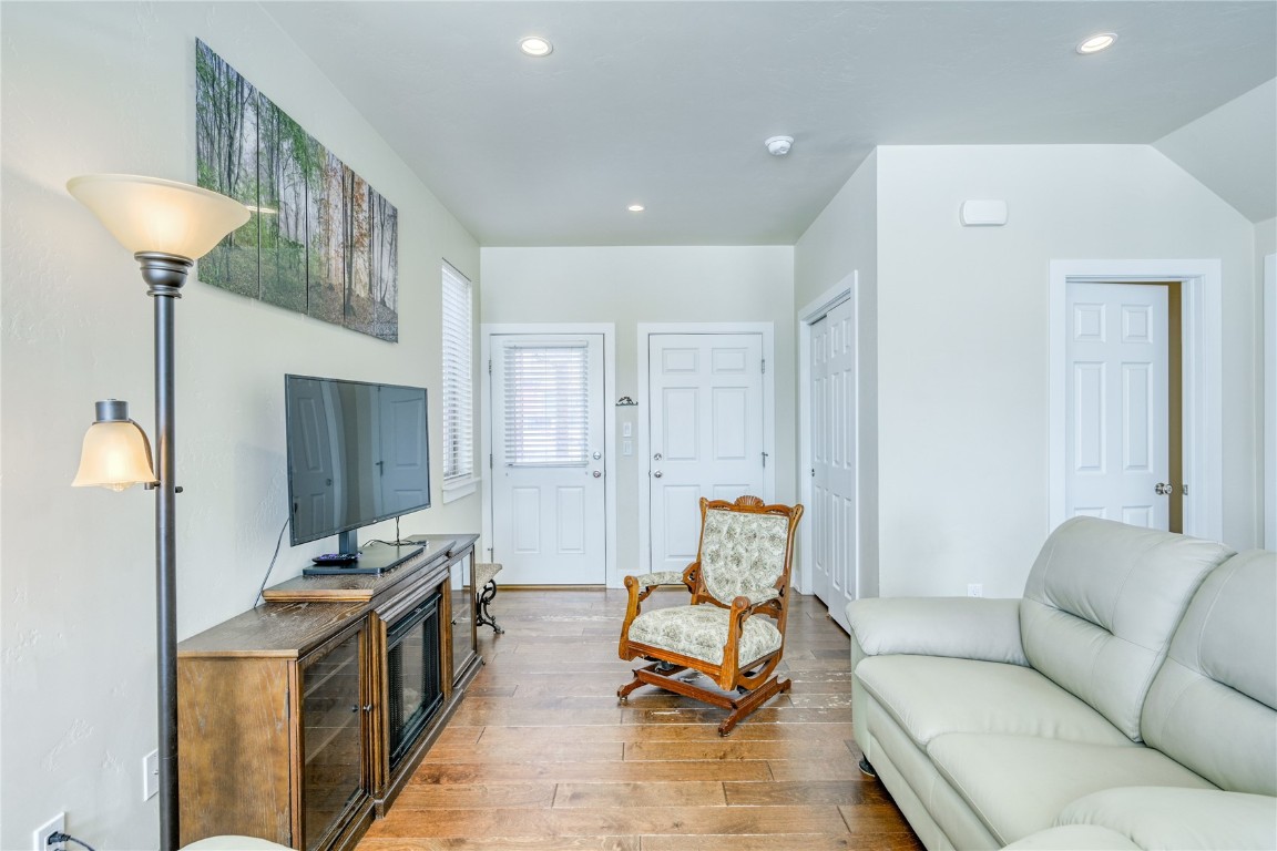 29 Haymaker Street, Unit 2B Silverthorne, CO 80498 - Photo 18 of 28 Living room with vaulted ceiling, light wood-style floors, and recessed lighting