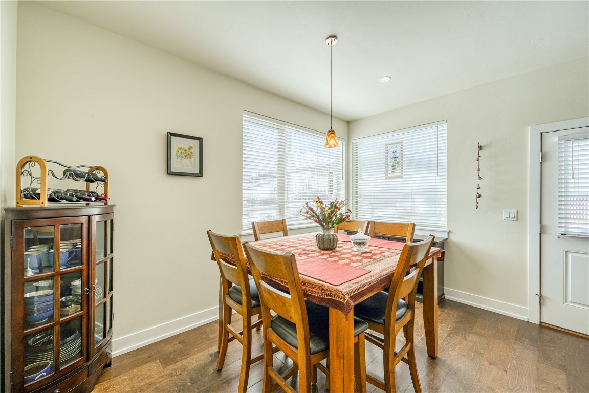 29 Haymaker Street, Unit 2B Silverthorne, CO 80498 - Photo 25 of 28 Dining room featuring dark wood-style floors and baseboards
