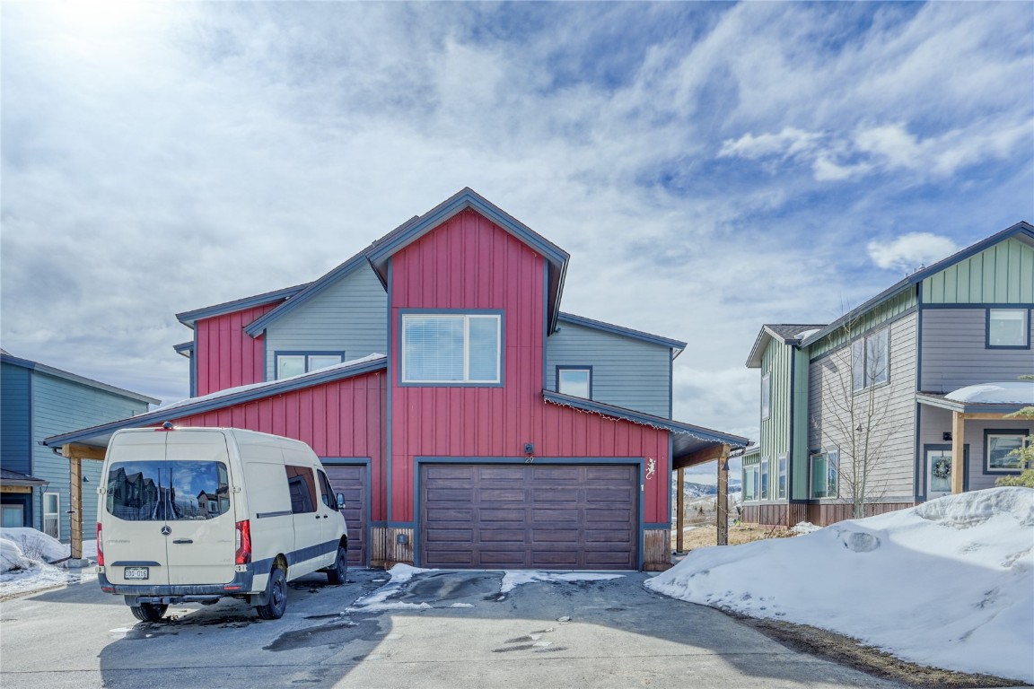 29 Haymaker Street, Unit 2B Silverthorne, CO 80498 - Photo 28 of 28 View of front facade featuring board and batten siding, driveway, and a garage