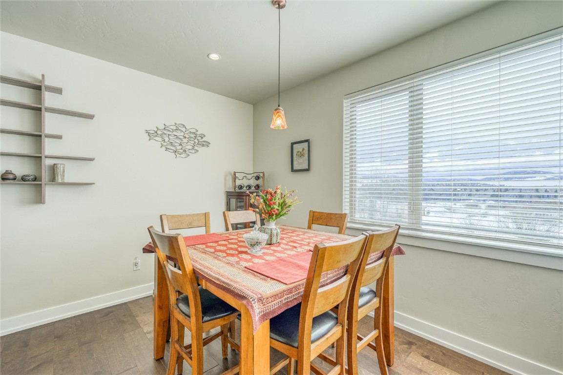 29 Haymaker Street, Unit 2B Silverthorne, CO 80498 - Photo 3 of 28 Dining area with baseboards, wood finished floors, and recessed lighting