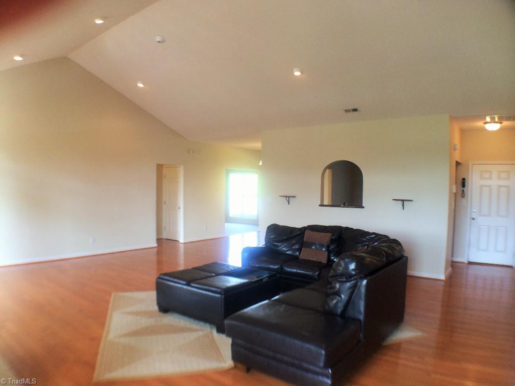 175 Sourwood Road State Road, NC 28676 - Photo 13 of 24 Spacious great room to relax by the fine, dining, or just sit back and enjoy the beautiful views the property offers.