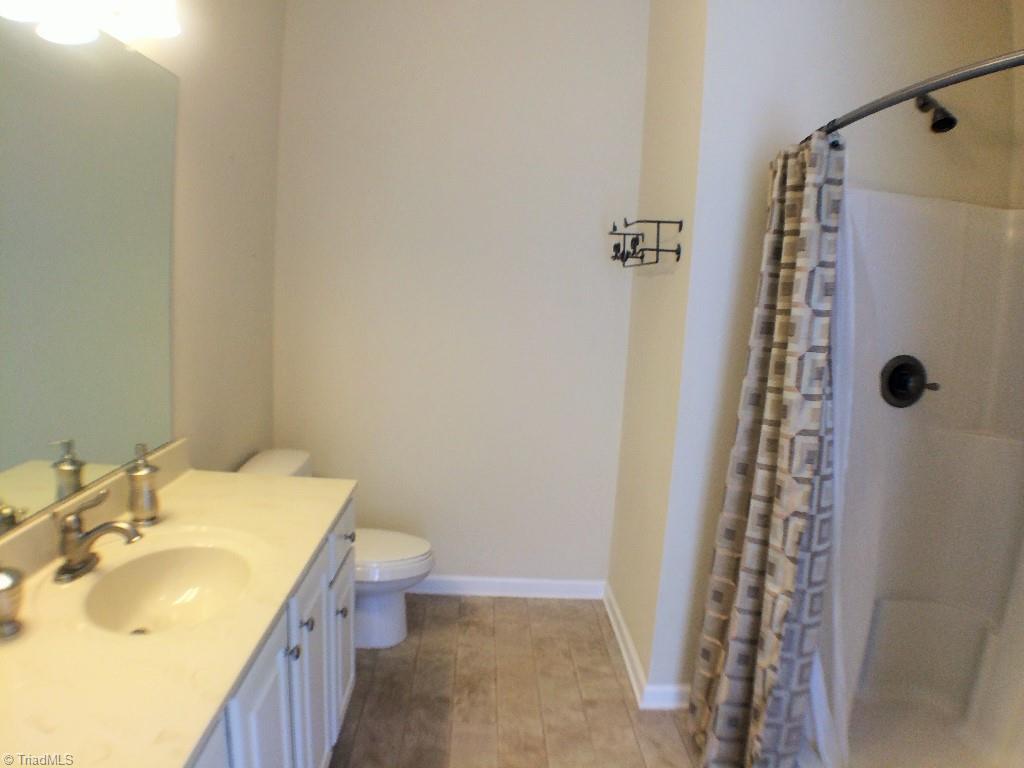 175 Sourwood Road State Road, NC 28676 - Photo 8 of 24 Owners Suit Full Bath with large vanity, walk-in shower and a large linen closet that is not shown in the picture.