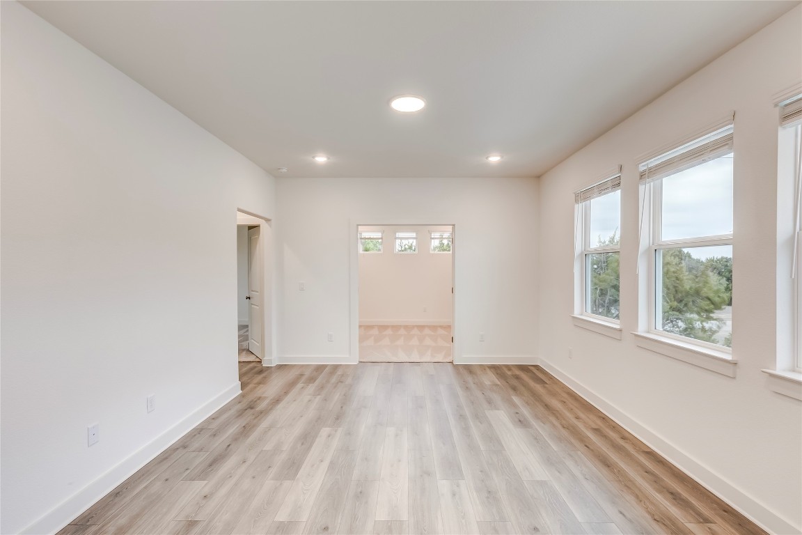 2000 Kit Circle Austin, TX 78758 - Photo 15 of 34 Spare room featuring light wood-style flooring and recessed lighting