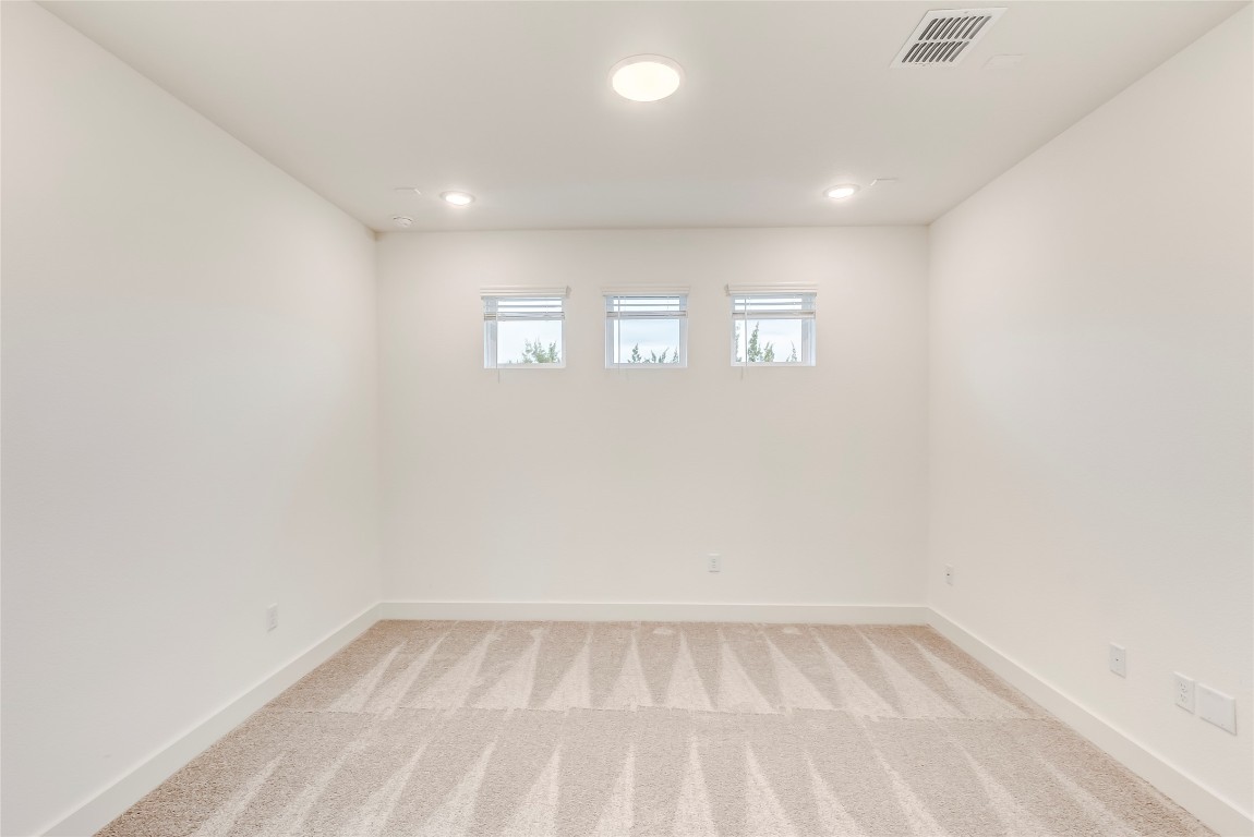 2000 Kit Circle Austin, TX 78758 - Photo 17 of 34 Empty room featuring light colored carpet and baseboards
