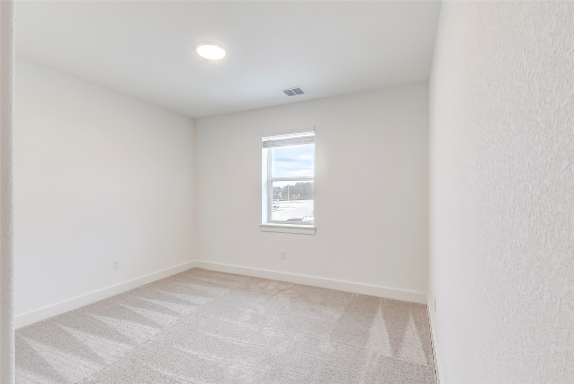 2000 Kit Circle Austin, TX 78758 - Photo 27 of 34 Unfurnished room with light colored carpet