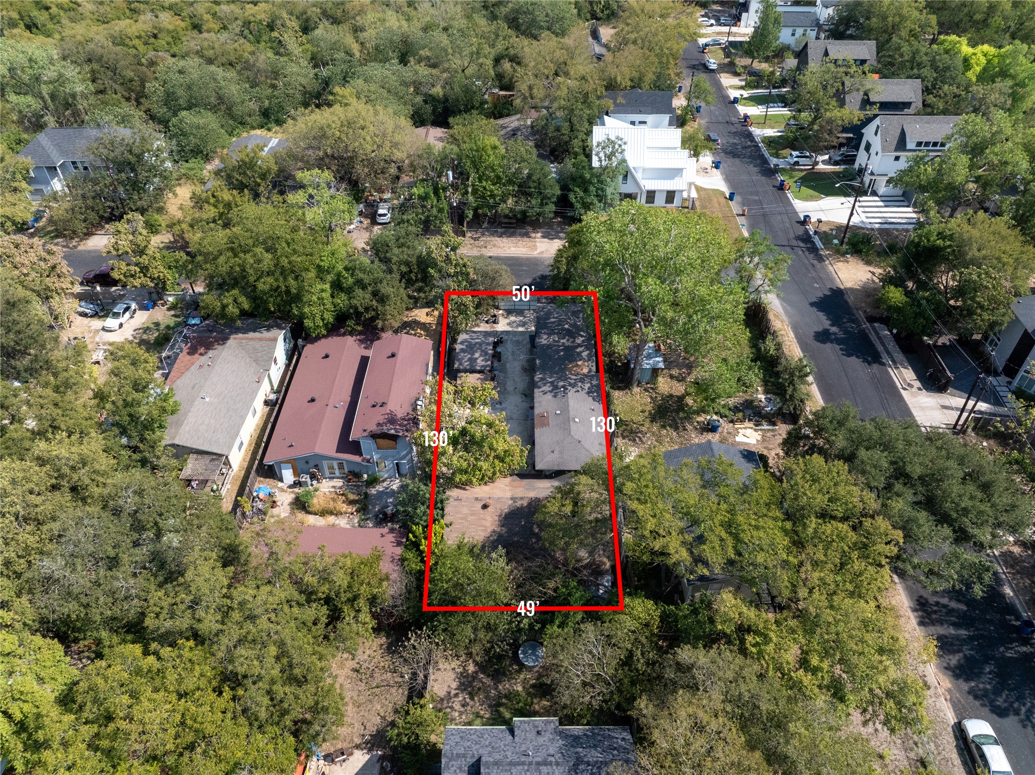 1112 Terry Drive Austin, TX 78721 - Photo 2 of 18 Aerial perspective of suburban area with property parcel outlined