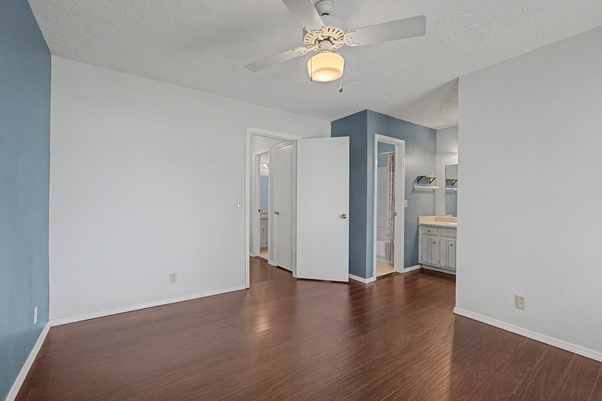 4316 Baton Rouge Drive Hermitage, TN 37076 - Photo 12 of 20 an empty room with wooden floor and a ceiling fan