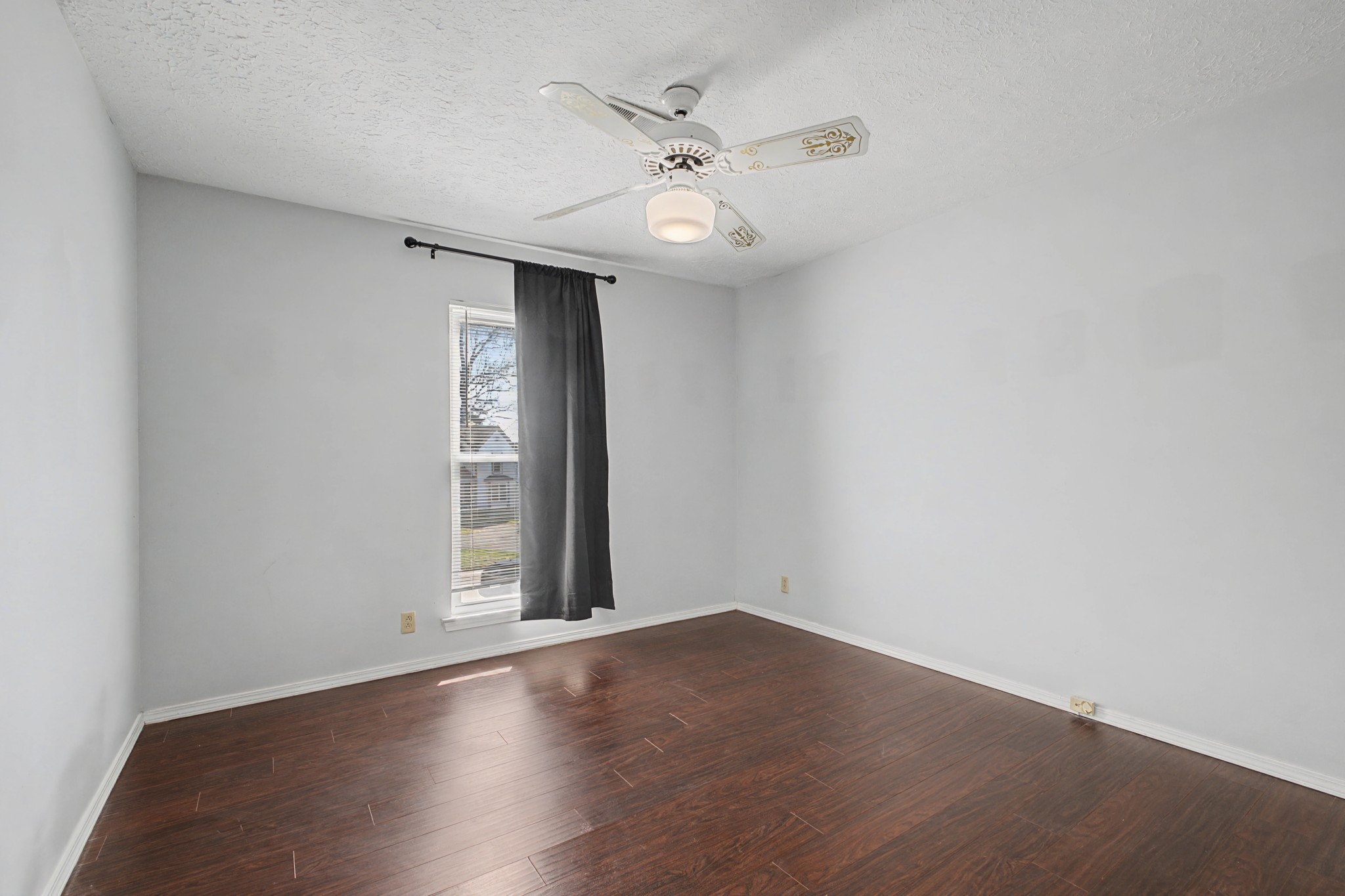 4316 Baton Rouge Drive Hermitage, TN 37076 - Photo 16 of 20 an empty room with wooden floor fan and windows