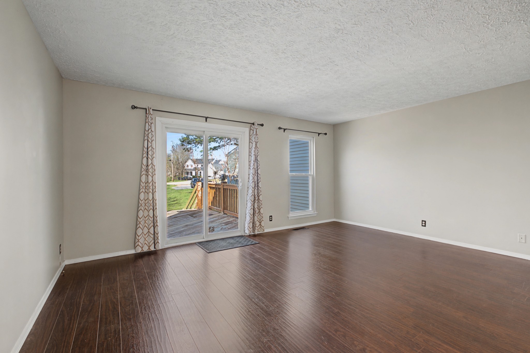 4316 Baton Rouge Drive Hermitage, TN 37076 - Photo 3 of 20 a view of an empty room with wooden floor and a window