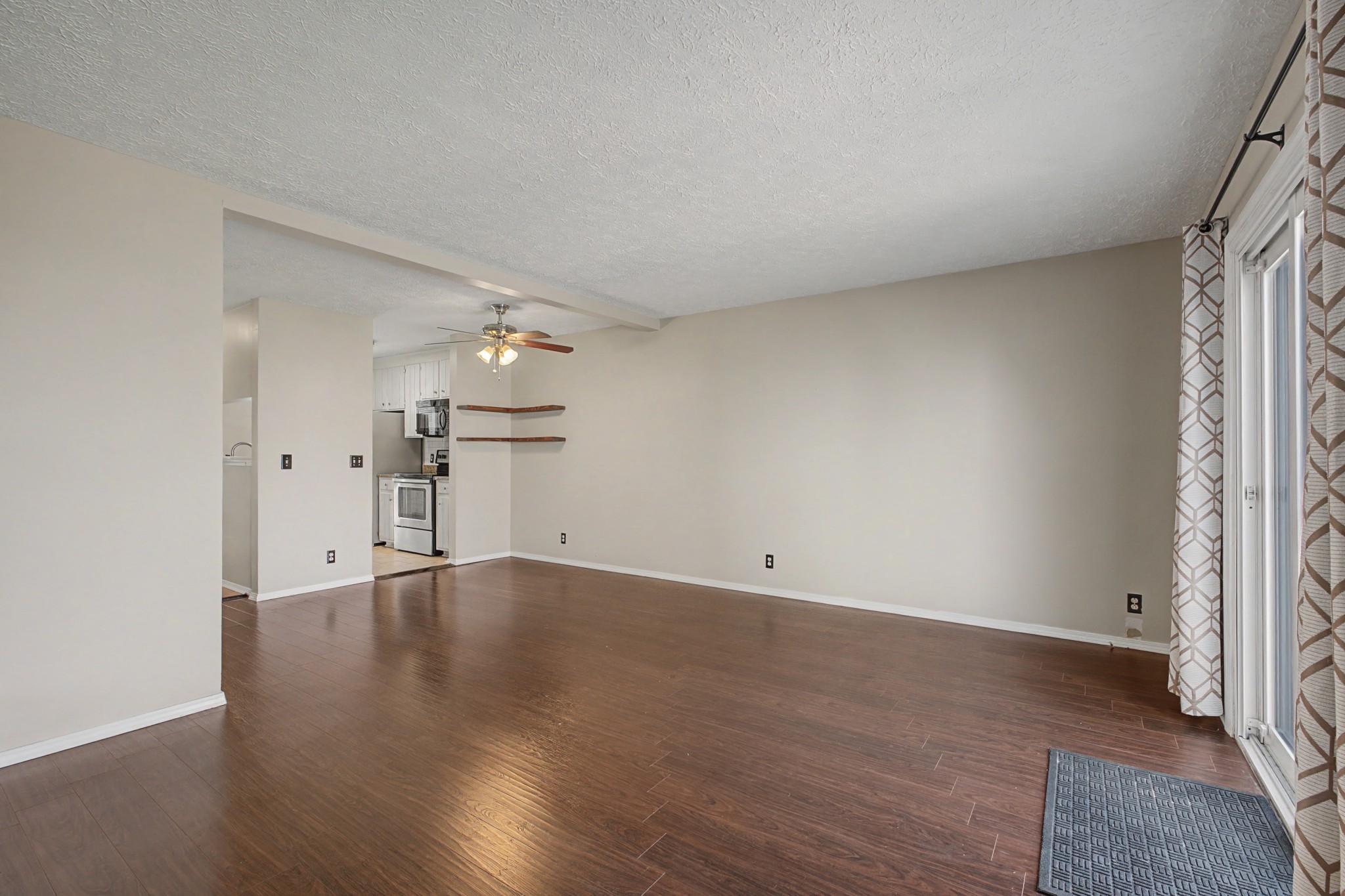 4316 Baton Rouge Drive Hermitage, TN 37076 - Photo 6 of 20 an empty room with wooden floor and windows